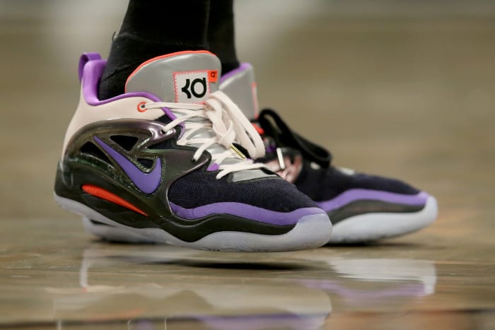 View of black and purple Nike KD shoes.